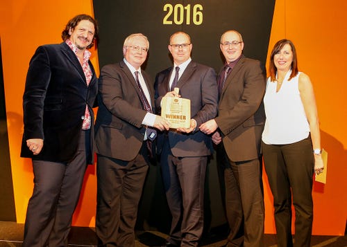 The Harts team receiving their award