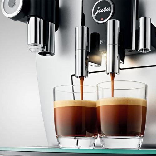 Jura Coffee Machine - close up of two coffees being made